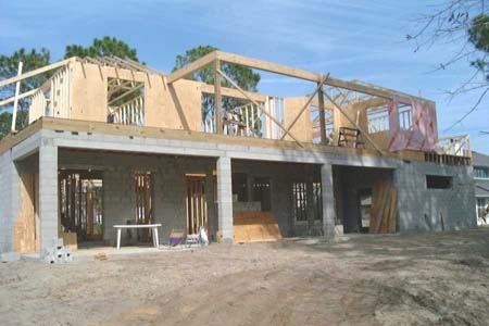 Framing second floor, roof trusses started