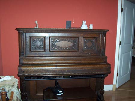 Restored piano in sitting room